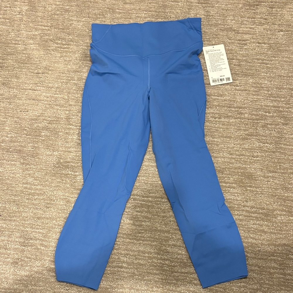 NWT Lululemon base pace, high-rise crop 23 inch inseam size 8 blue Nile.